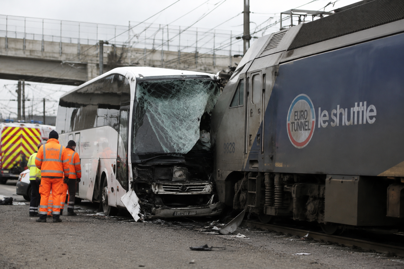 Bus hits stopped train on French side of Channel Tunnel, injuring 19
