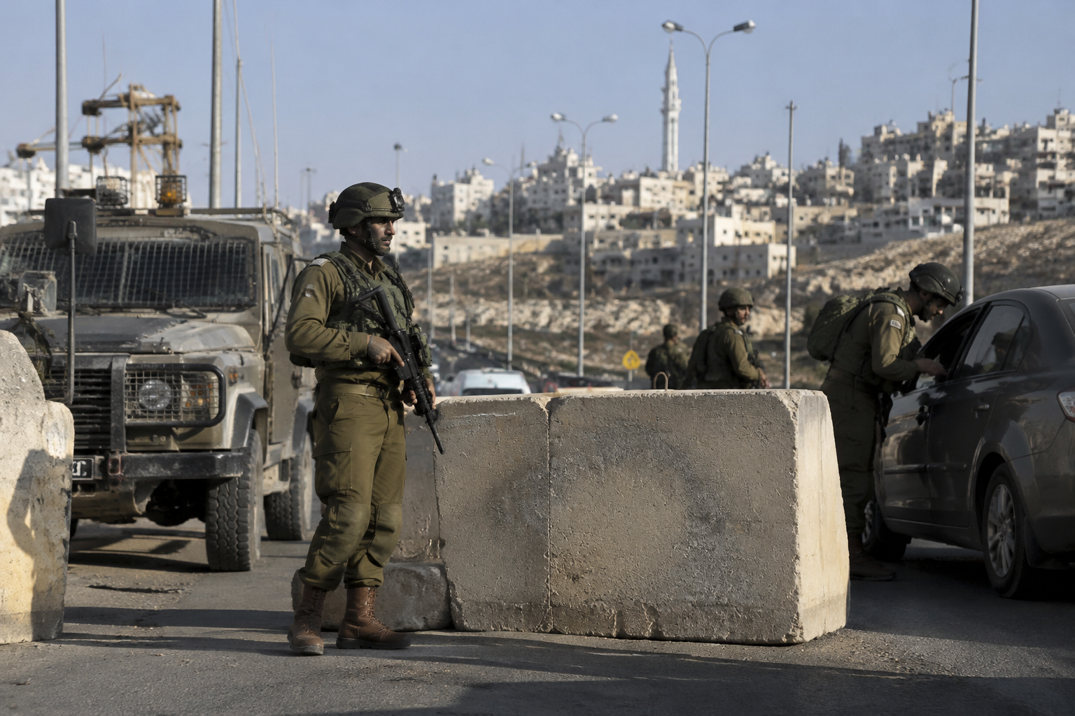 Israel orders West Bank closure after soldiers kill two alleged attackers